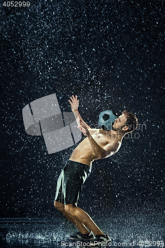 Image of Water drops around football player