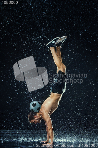 Image of Water drops around football player