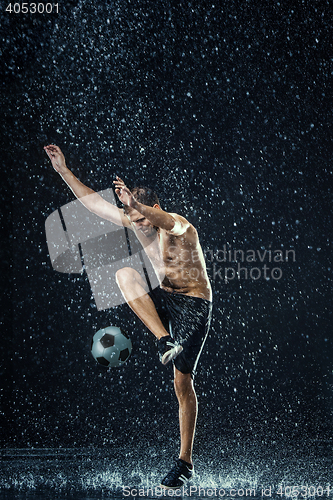 Image of Water drops around football player