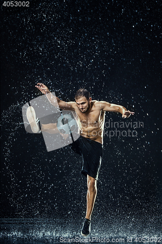 Image of Water drops around football player