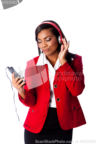 Image of Business woman jamming listening to music