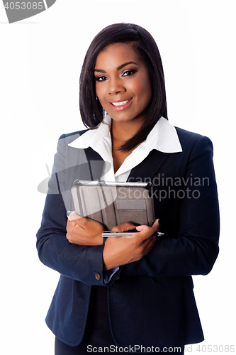 Image of Smiling successful business woman standing with tablet