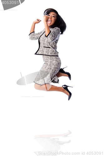 Image of Winning business woman jumping cheering
