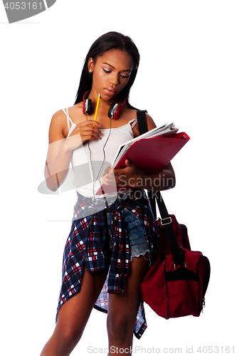 Image of Student with notepad binders thinking