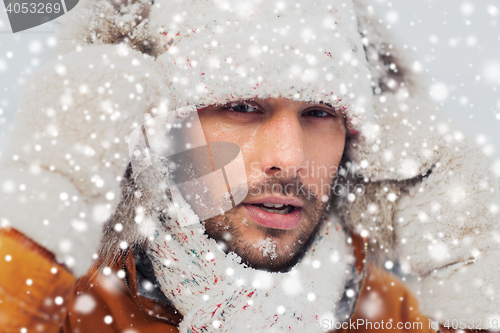 Image of face of man in winter clothes outdoors