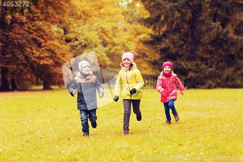 Image of group of happy little kids running outdoors