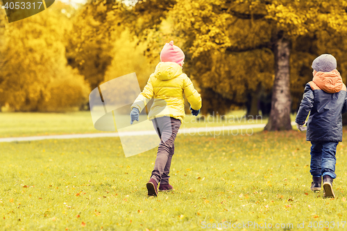 Image of group of happy little kids running outdoors