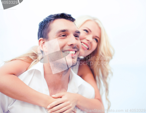Image of couple having fun on the beach