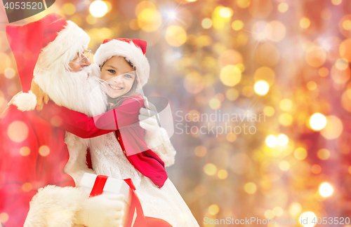 Image of smiling little girl with santa claus