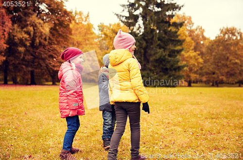 Image of group of happy children in autumn park