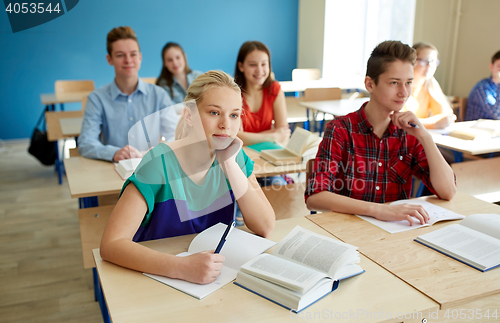 Image of group of students with books at school lesson