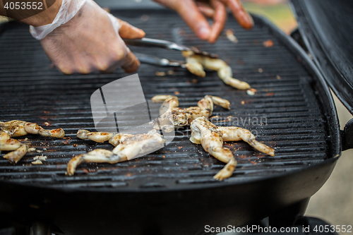 Image of close up of frog meat grill at street market