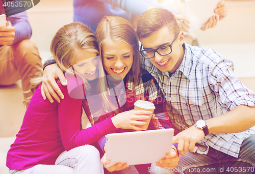 Image of group of students with tablet pc and coffee cup