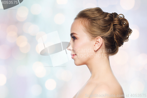 Image of beautiful young woman face over white background