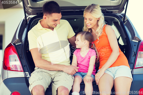 Image of happy family with hatchback car outdoors