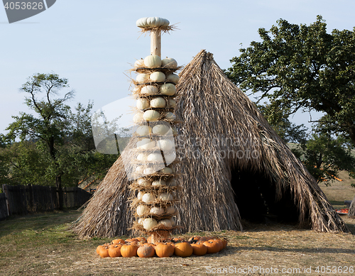 Image of Ripe autumn pumpkins arranged on totem