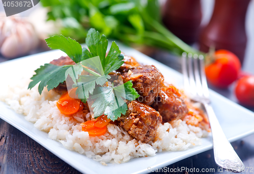 Image of boiled rice with sauce