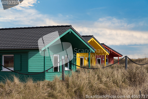 Image of colorful wooden tiny houses on the island