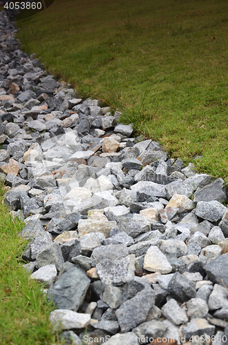 Image of Stone and green grass