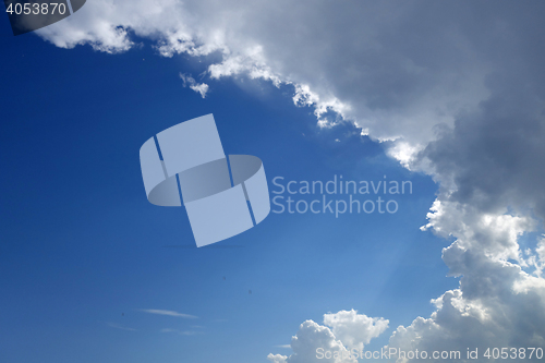 Image of Blue sky with rain clouds