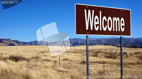 Image of Welcome brown road sign