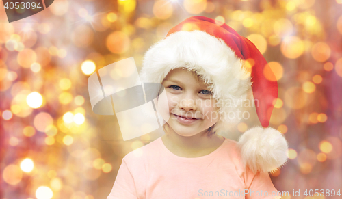 Image of smiling little girl in santa hat