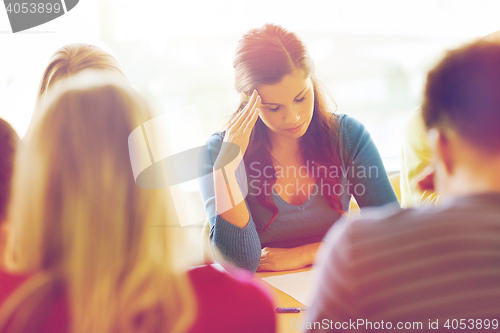 Image of group of students with papers