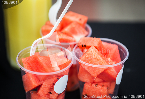 Image of close up of chopped watermelon in plastic cups
