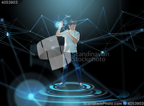 Image of happy man in virtual reality headset or 3d glasses