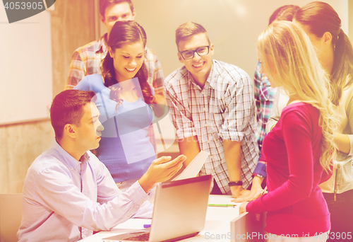 Image of group of students and teacher with laptop