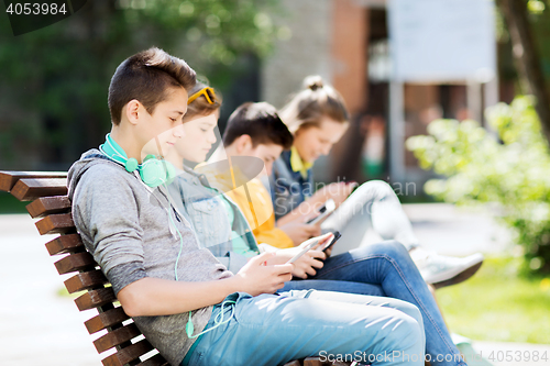 Image of happy teenage boy with tablet pc and headphones