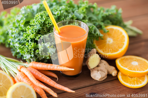 Image of glass of carrot juice, fruits and vegetables