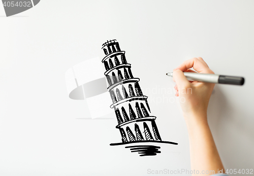 Image of hand drawing leaning tower of pisa on white board
