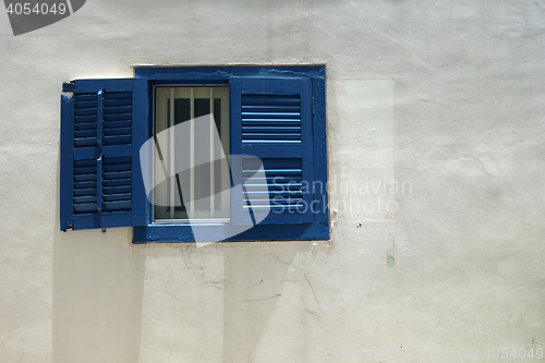 Image of Isolated blue window with white wall