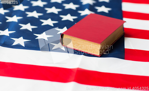 Image of close up of american flag and book