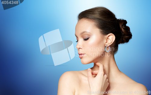 Image of close up of beautiful woman face with earring