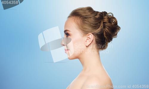 Image of beautiful young woman face over white background