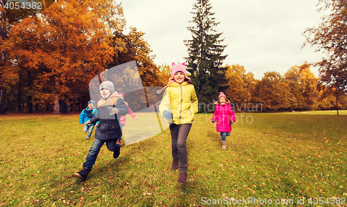 Image of group of happy little kids running outdoors