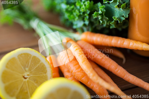 Image of close up of carrot, lemon and lettuce