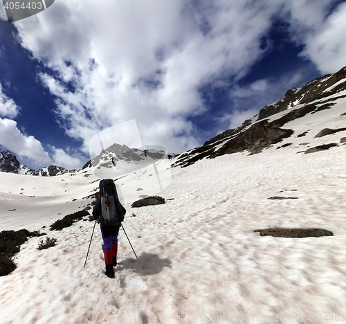 Image of Hiker in snow mountain at sun day