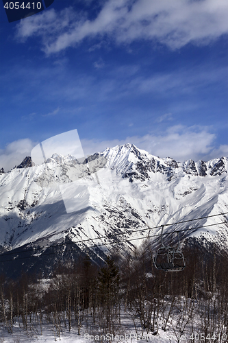 Image of Ski lift in snow mountains at nice winter day