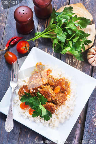 Image of boiled rice with sauce