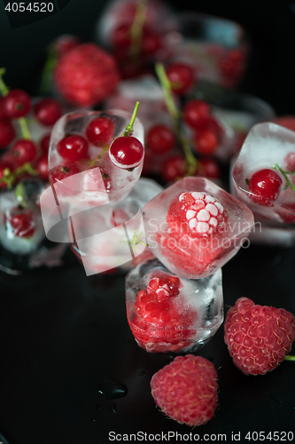 Image of Frozen berries on wooden table