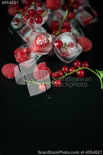 Image of Frozen berries on wooden table