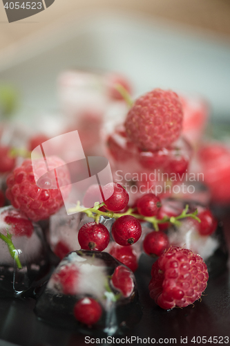 Image of Frozen berries on wooden table