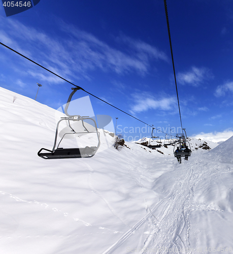 Image of Chair-lift at ski resort in sun winter day
