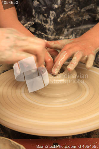 Image of working on spinning wheel