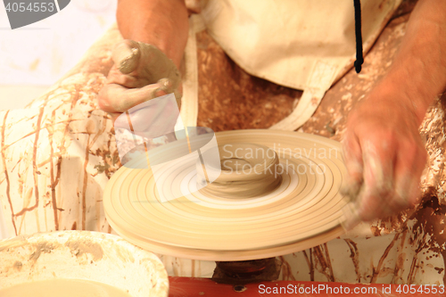 Image of working on spinning wheel