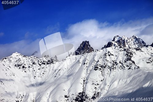 Image of Snow avalanches mountainside in clouds