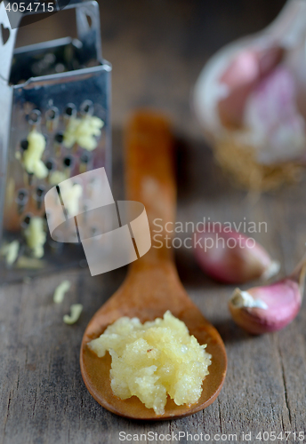 Image of Garlic on wooden background